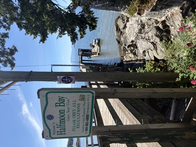 Halfmoon Bay shoreline and village setting on a sunny day