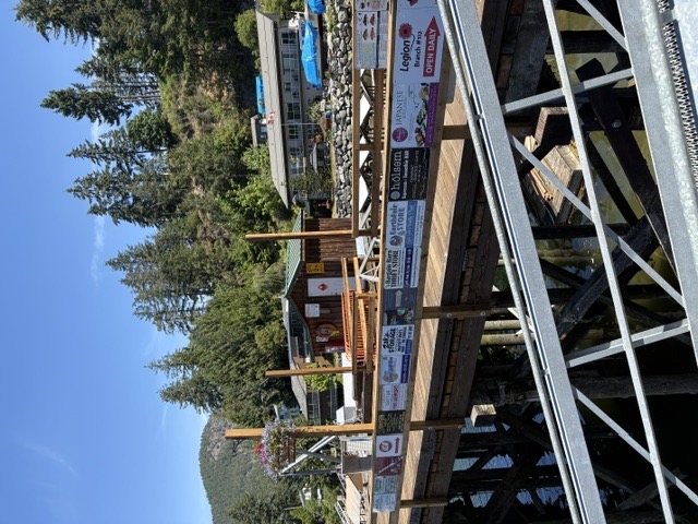 Pender Harbour marina with boats, calm water, and forested hills